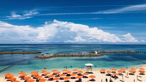 Private beach, white sand, beach cabanas, beach umbrellas
