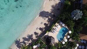 On the beach, sun-loungers, beach umbrellas, beach towels