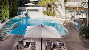 Outdoor pool, pool umbrellas, sun loungers