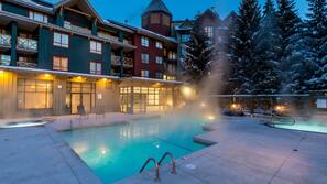 Outdoor pool, open 7:00 AM to 10:00 PM, pool umbrellas