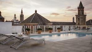 Seasonal outdoor pool, open noon to 9 PM, pool umbrellas, pool loungers