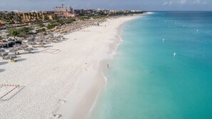 On the beach, white sand, free beach cabanas, sun loungers