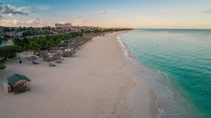 On the beach, white sand, free beach cabanas, sun loungers