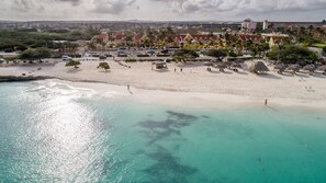 On the beach, white sand, free beach cabanas, sun loungers