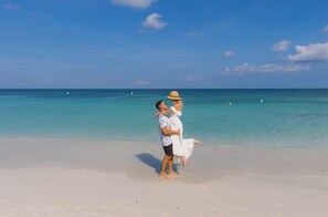 On the beach, white sand, free beach cabanas, sun loungers