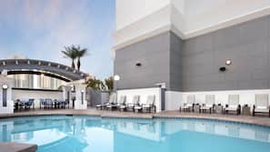 Outdoor pool, open 7:00 AM to 11:00 PM, sun loungers
