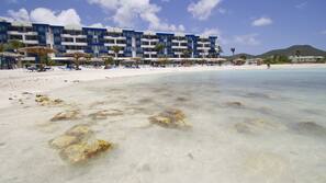 On the beach, sun loungers, beach umbrellas, beach towels