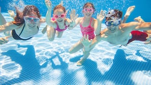 Indoor pool, pool umbrellas, pool loungers