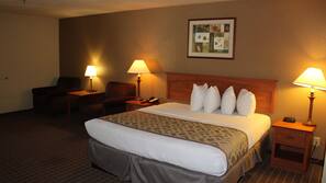 Premium bedding, desk, laptop workspace, blackout drapes