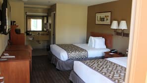 Premium bedding, desk, laptop workspace, blackout drapes