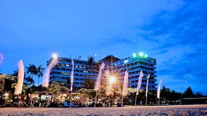 On the beach, white sand, sun-loungers, beach towels