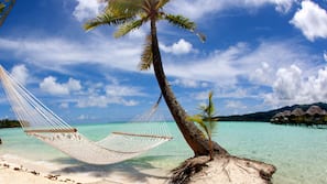 Private beach, white sand, sun-loungers, beach umbrellas