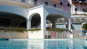 Seasonal outdoor pool, pool umbrellas, sun loungers