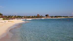 Private beach, white sand, beach umbrellas, beach towels