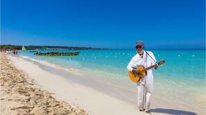 On the beach, white sand, free beach shuttle, sun loungers