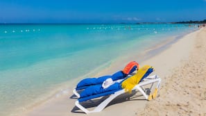 On the beach, white sand, free beach shuttle, sun loungers