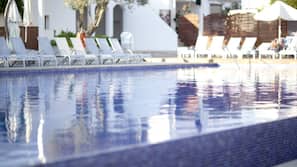 Seasonal outdoor pool, open 11:00 AM to 7:00 PM, pool umbrellas