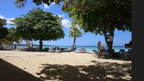 On the beach, sun loungers, beach towels, beach massages