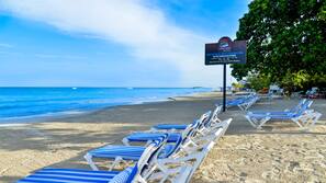 On the beach, sun loungers, beach towels, beach massages