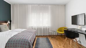 Premium bedding, blackout curtains, free WiFi, linens
