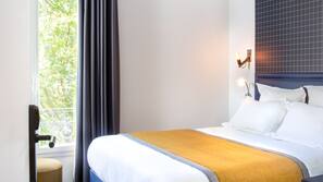 Luxe beddengoed, een kluis op de kamer, een bureau