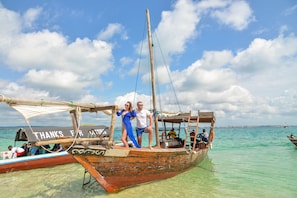 On the beach, white sand, sun loungers, beach umbrellas