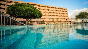 Indoor pool, outdoor pool, pool umbrellas