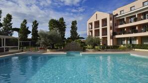Seasonal outdoor pool, pool umbrellas, pool loungers
