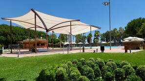 Seasonal outdoor pool, pool umbrellas, pool loungers