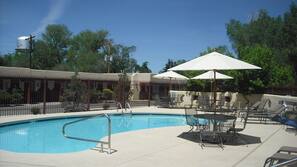 Seasonal outdoor pool, open 10:00 AM to 9:00 PM, pool umbrellas