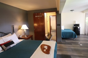 Deluxe Room, Multiple Beds, Private Bathroom | Individually decorated, free WiFi