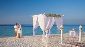 On the beach, white sand, beach towels, waterskiing