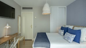 Ropa de cama de alta calidad, minibar, caja fuerte y escritorio