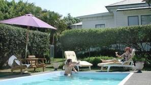 Seasonal outdoor pool, pool loungers