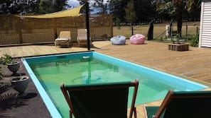 Seasonal outdoor pool, pool loungers