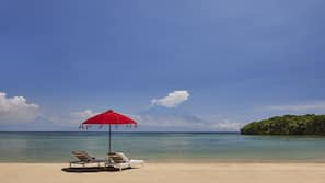 Beach nearby, white sand, beach towels, beach volleyball