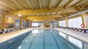 Indoor pool, seasonal outdoor pool, pool umbrellas, pool loungers