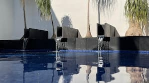 Outdoor pool, open 8:00 AM to 9:00 PM, pool loungers
