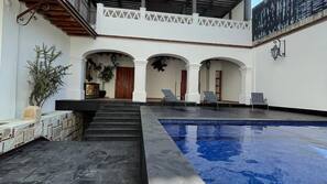 Outdoor pool, open 8:00 AM to 9:00 PM, pool loungers