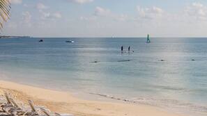 Private beach, white sand, sun loungers, beach umbrellas