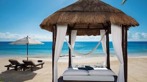 Private beach, white sand, sun loungers, beach umbrellas