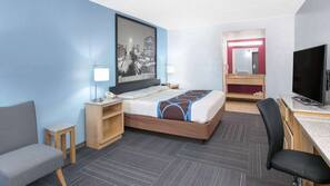 Premium bedding, desk, laptop workspace, blackout drapes