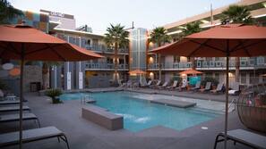 Outdoor pool, open 6:00 AM to 9:00 PM, pool umbrellas, pool loungers