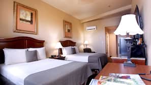 Premium bedding, desk, laptop workspace, blackout drapes