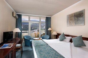 Standard Double Room | Minibar, in-room safe, desk, blackout drapes