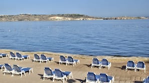 Beach nearby, beach umbrellas, beach towels, beach volleyball