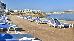 Beach nearby, beach umbrellas, beach towels, beach volleyball