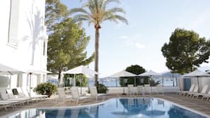 Seasonal outdoor pool, open 8 AM to 8 PM, pool umbrellas