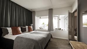 Premium bedding, desk, laptop workspace, blackout curtains