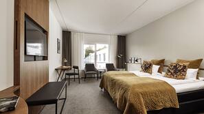 Premium bedding, desk, laptop workspace, blackout curtains
